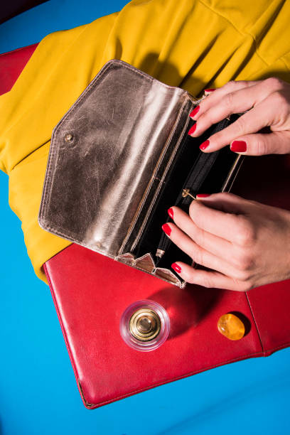istock Elegant woman's hand is packing out her makeup stuff. 1184450717