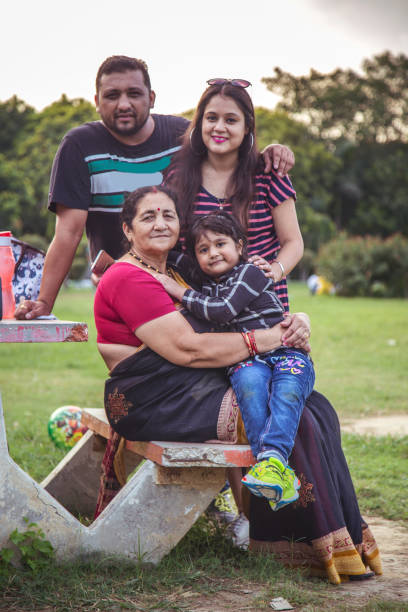 istock Indian Family Having Fun In Park 1184451074