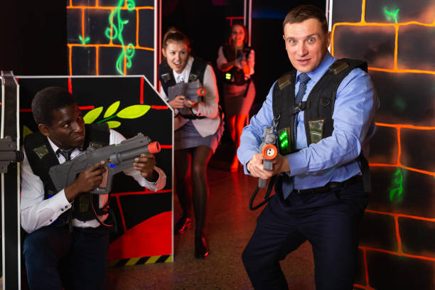 istock men and women co-workers having corporate entertainment 1184453396