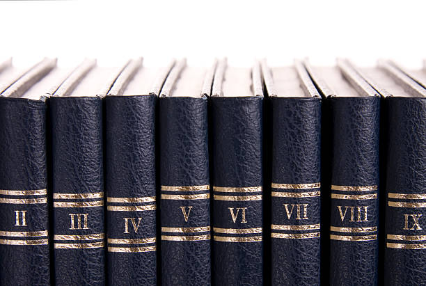 Blue books II - IX lined up in order Row of old books with roman numbers law library stock pictures, royalty-free photos & images
