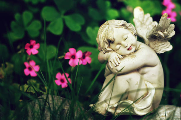 istock Guardian angel sleeping on the stone 1184456809