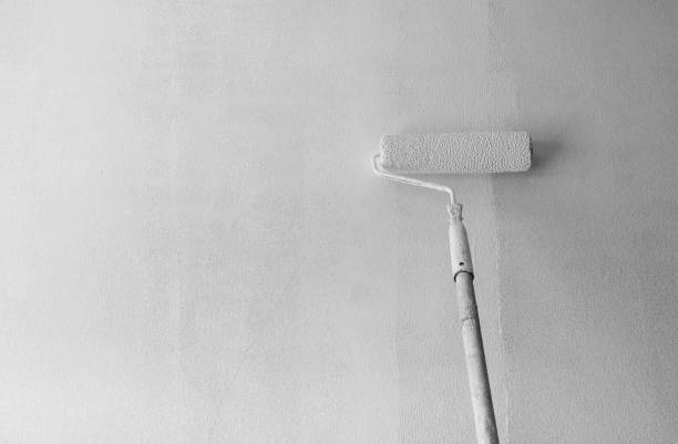 istock Painting primer white on cement wall 1184456943