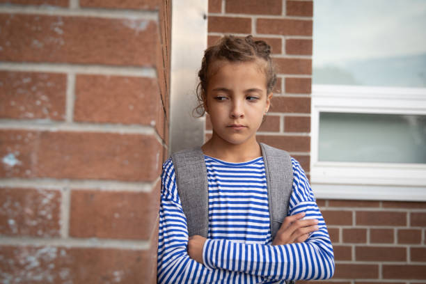 istock Upset young girl in the elementary school 1184457098