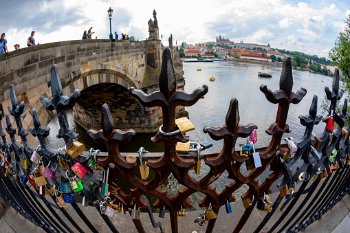 Prague, Czech Republic - Jun 23, 2019: Love locks near the Charles Bridge in Prague on the Vltava River