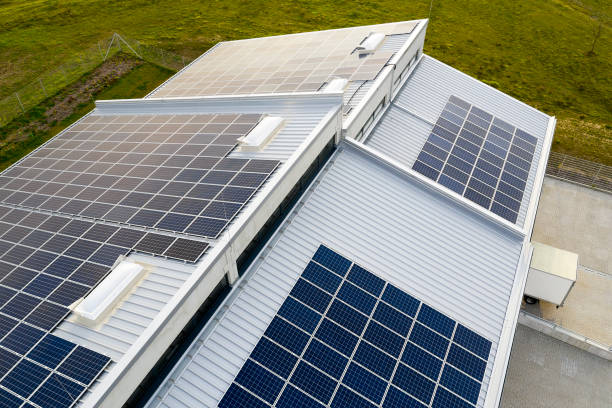 Solar Panel Photovoltaic Installation on Roof of Modern Building stock photo