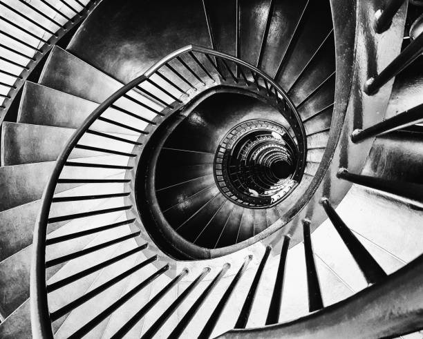 istock Dramatic spiral staircase made of steel 1184458493