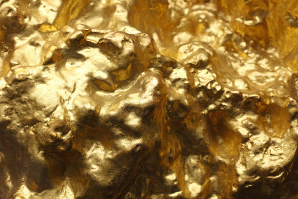 istock Close up gold slug nugget surface 1184458609