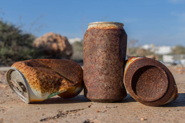 Used rusty aerosol can on the ground
