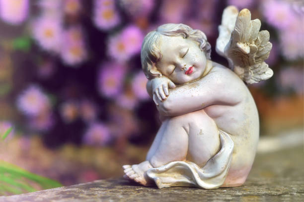 istock Guardian angel and pink asters 1184460015
