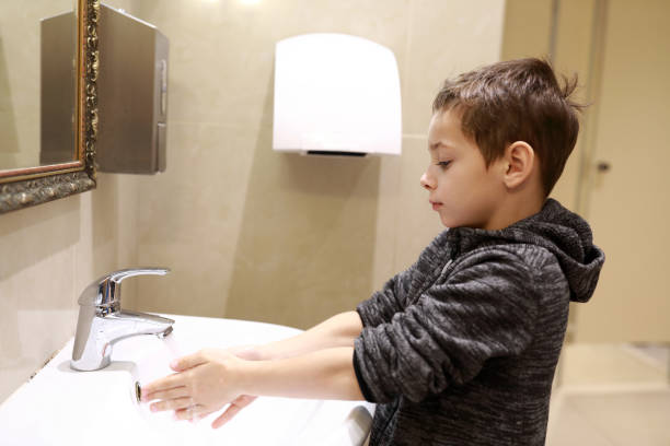 istock Child washing his hands 1184461771