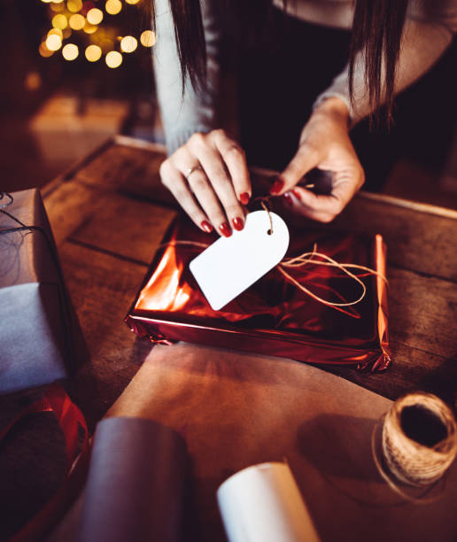 istock woman making the package for the christmas gift 1184461861