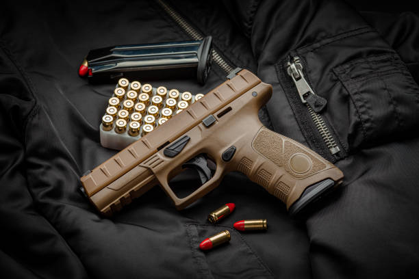 black gun pistol isolated on white background - airsoft gun imagens e fotografias de stock