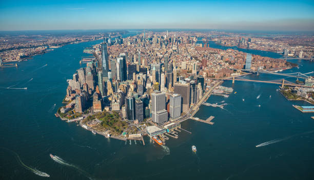 Aerial view to New York City Skyline View from helicopter to the Manhattan, Brooklyn, Long Island and Jersey City east river new york city photos stock pictures, royalty-free photos & images