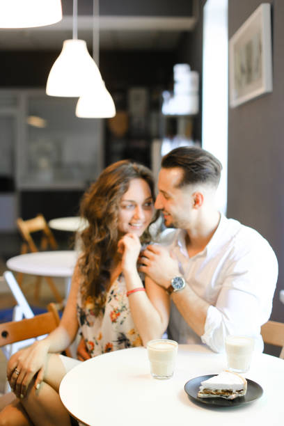 istock Young husband hugging wife at cafe and resting 1184466603