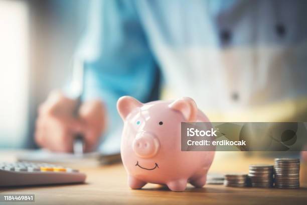 Businessman With A Piggy Bank Stock Photo - Download Image Now - Piggy Bank, Savings, Financial Loan