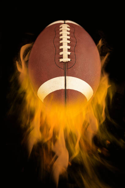 istock American football with fire 1184473470