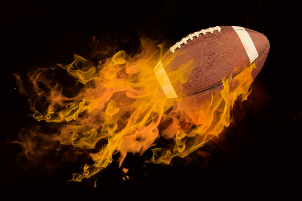 istock American football with fire 1184473591