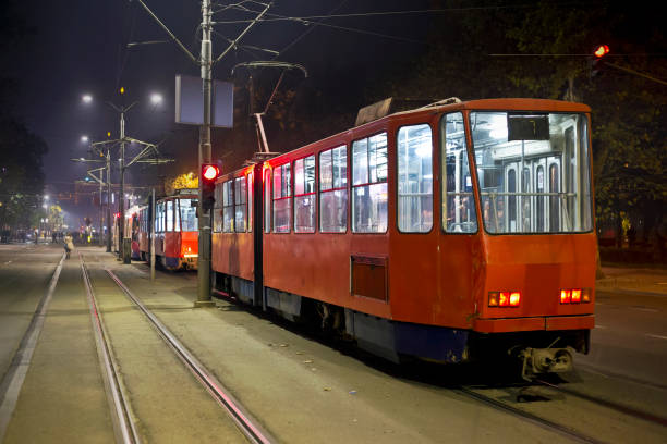 istock Red trams in the night 1184476656