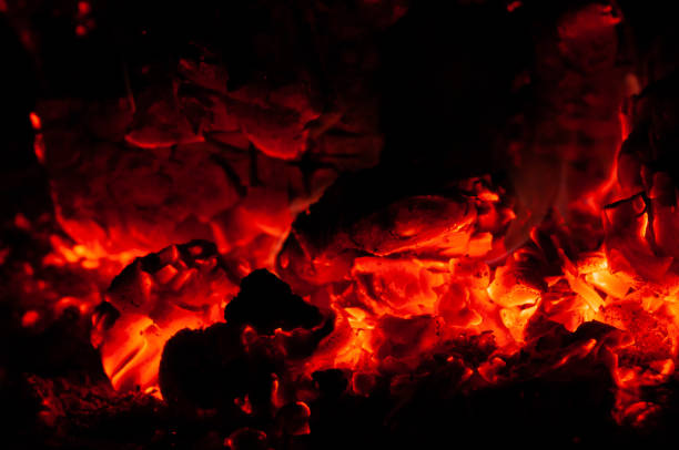 istock Bright colorful glowing orange-red embers bonfire. 1184479146