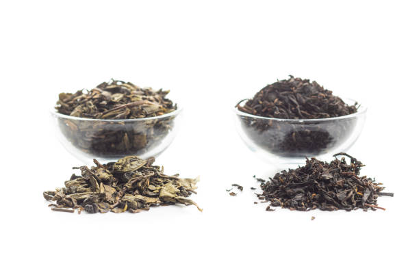 istock Dried black and green tea leaves. 1184480645