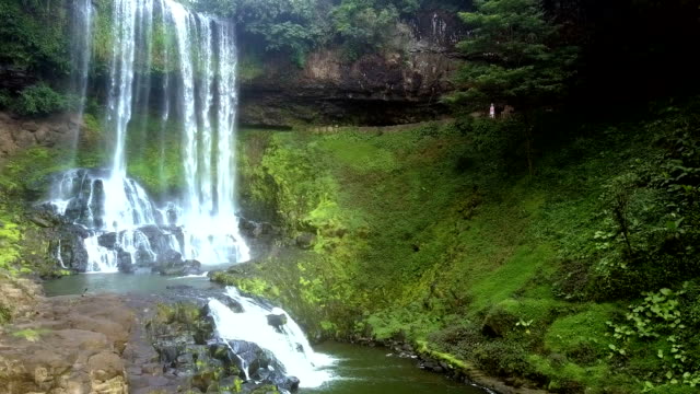 mountain river creates waterfall and rapids in park