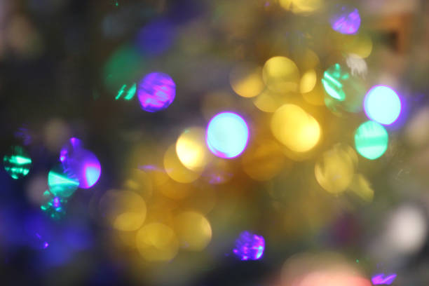 istock Bright blue and orange glittering Christmas lights 1184484051