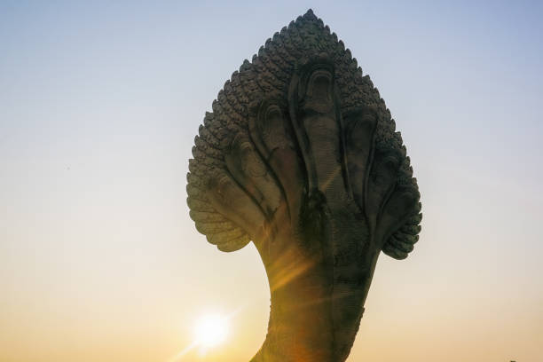 Ancient Angkor Wat statues at sunrise