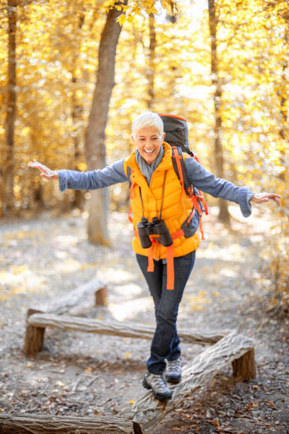 istock Senior women is having fun while hiking. 1184489389
