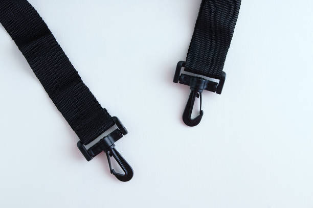 istock Close-up black textile handle for a bag with plastic carabiners. 1184490816