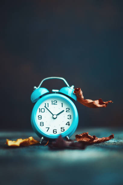 istock Time for Fall. Alarm clock with leaves. Daylight Savings Time. 1184498995