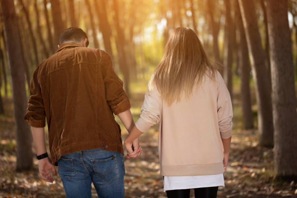 istock young lovers doing hiking in the forest 1184500566