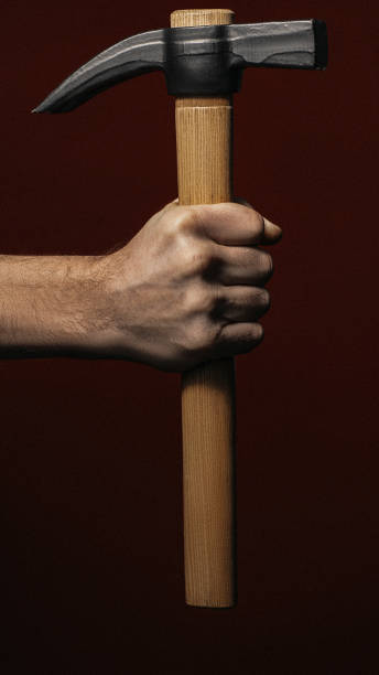 istock professional handyman service man hand claw hammer 1184502382