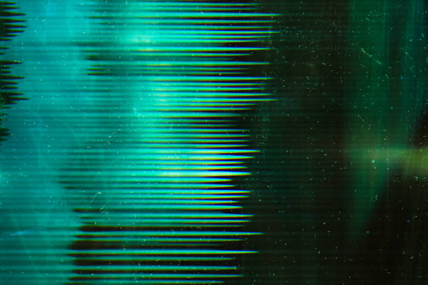 green aged filmstrip distressed texture dust Green aged filmstrip. Distressed texture. Dust scratches on dark glowing surface. intro music photos stock pictures, royalty-free photos & images
