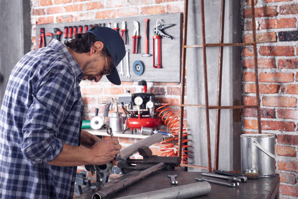 istock Metalworker tightening a bolt or clamp 1184502718