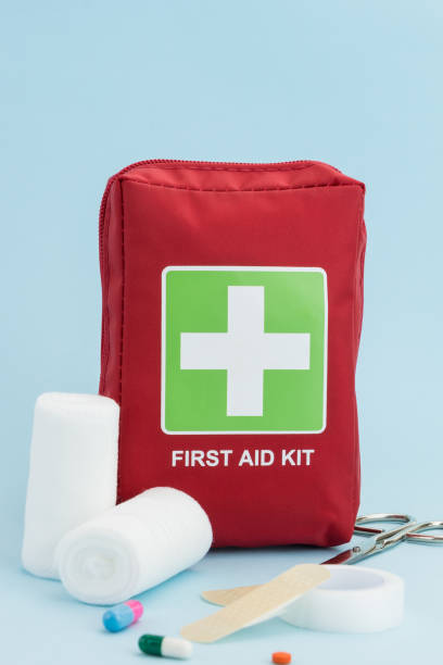 istock First aid kit with medical equipment, on light blue background 1184502827