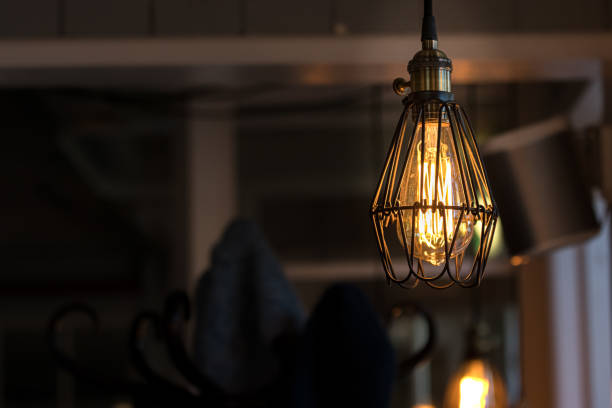 istock One Vintage led filament light bulbs hanging. 1184503231