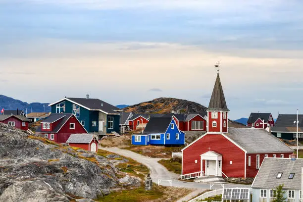 The Cathedral of Our Saviour Annaassisitta Oqaluffia and colorful houses in Nuuk, Greenland.