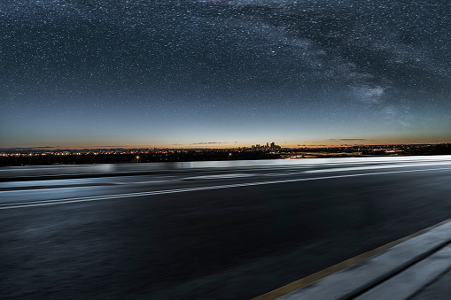 Urban road travel through Calgary city at a starry night,Canada