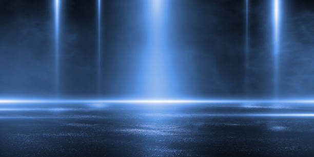 istock 3D rendering abstract dark empty scene blue neon searchlight light wet asphalt smoke night view rays. 1184508762