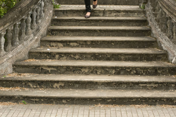 Hue, Thua Thien-Hue, Vietnam - February 27, 2011: Tourist walking down the staircase at Forbidden Purple City in Hue, a city in central Vietnam that was national capital  from 1802 to 1945