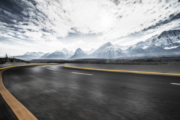 istock Empty road travel through canadian rockies 1184512443