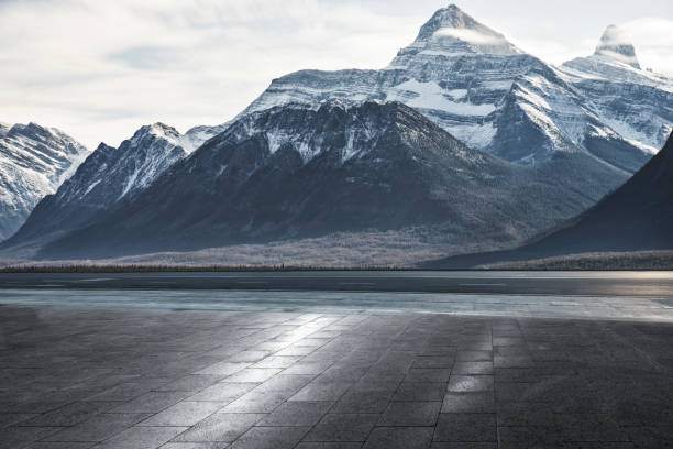 istock empty patio front of snowy mountains 1184513080