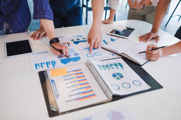istock Business Corporate team brainstorming with chart and checking and analysis 1184513964