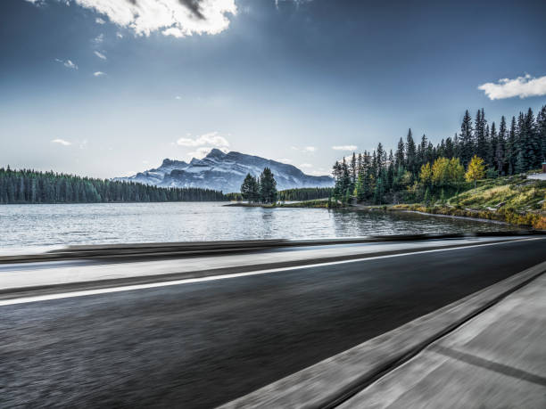 istock Empty road by Two Jack Lake in Jasper 1184514078