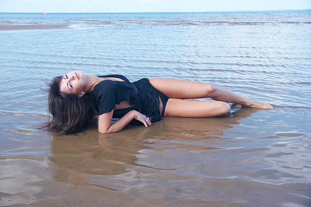 Girl lies on water stock photo