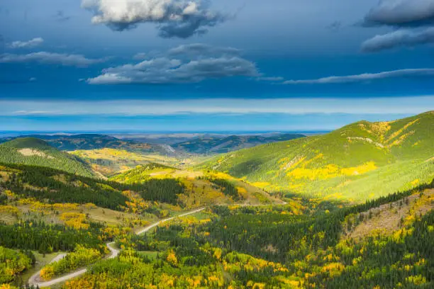 Photo of Overhead view of autumn landscape and winding Highway 22 in Alberta