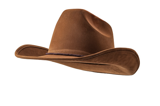 Rodeo horse rider, wild west culture, Americana and American country music concept theme with a brown leather cowboy hat isolated on white background with clip path cut out