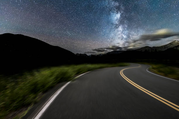 istock A winding two-lane highway runs under starry sky,Alberta 1184524511