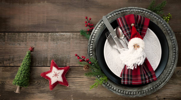 istock Christmas Dining Plate on an Old Wood Table 1184525035