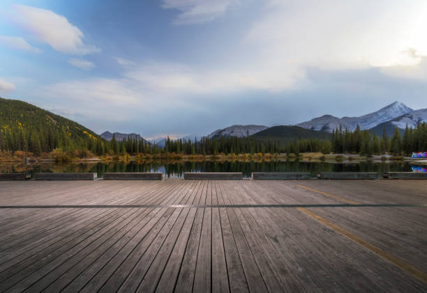 Empty wooden deck front of Forget-Me-Not Pond,Alberta,Canada.